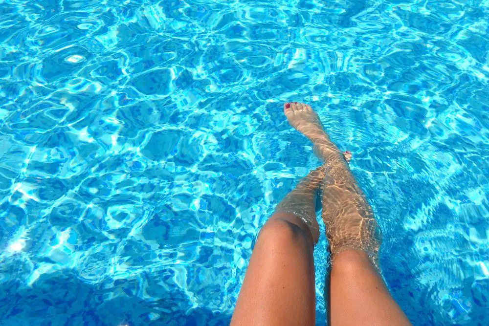 womans legs in pool